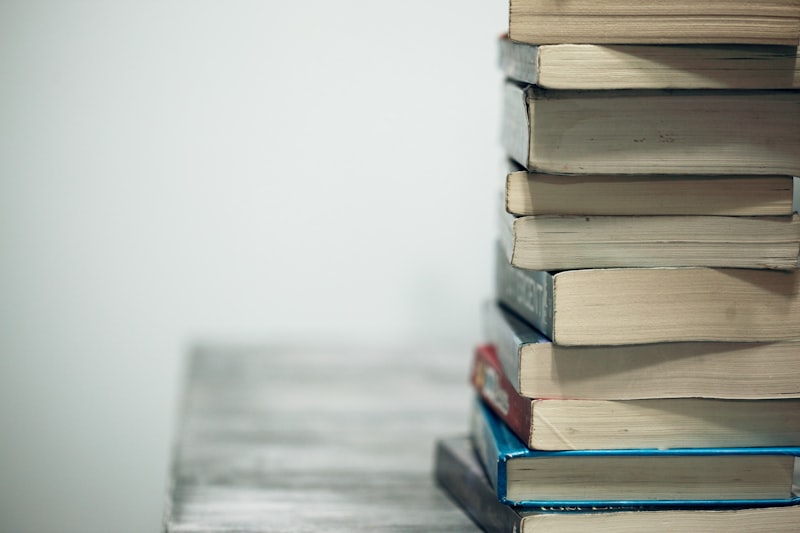 Rows of fiction titles on wooden shelves